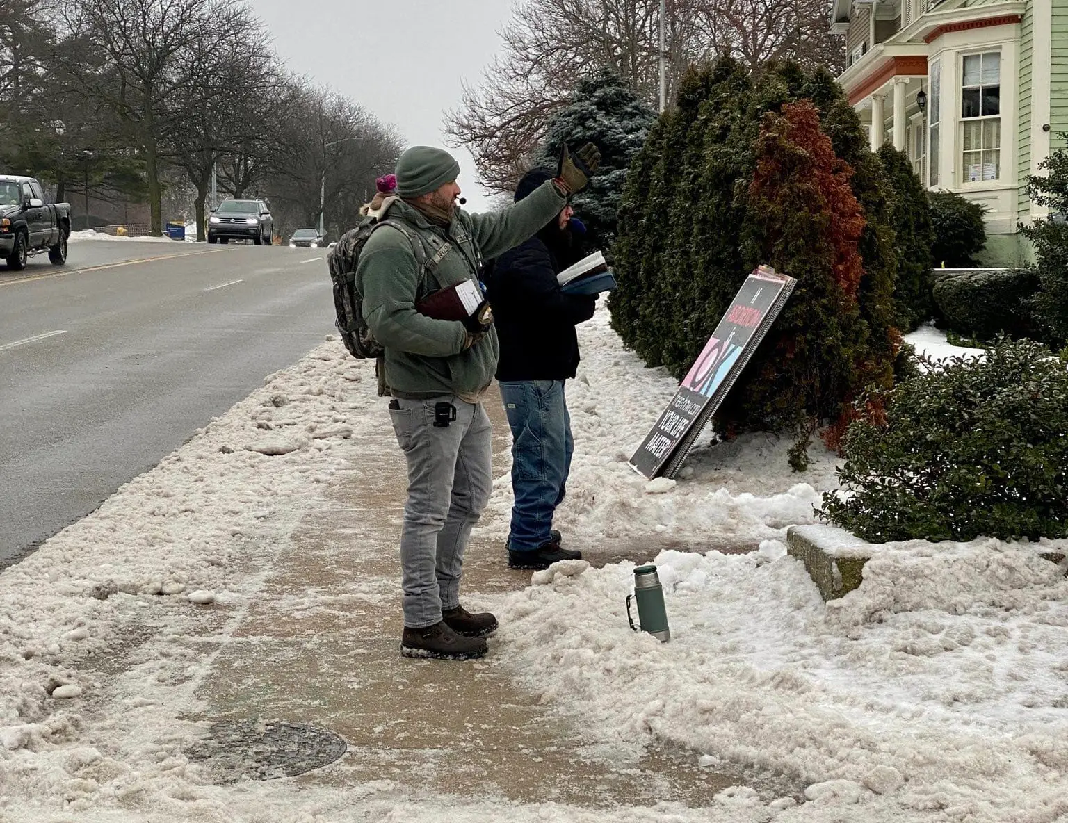 Men preaching during winter